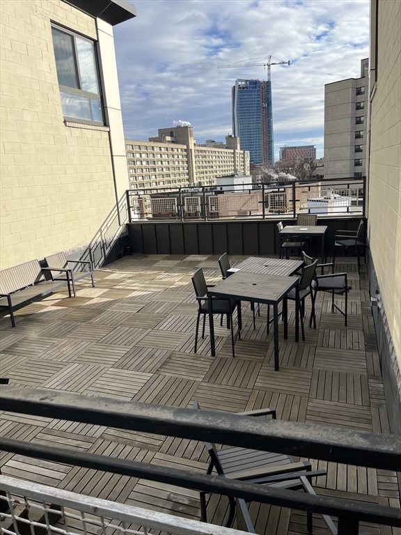 12 Stoneholm Street, Unit 322 Boston, MA 02115 - Photo 28 of 33 a view of a dining room with furniture and a window