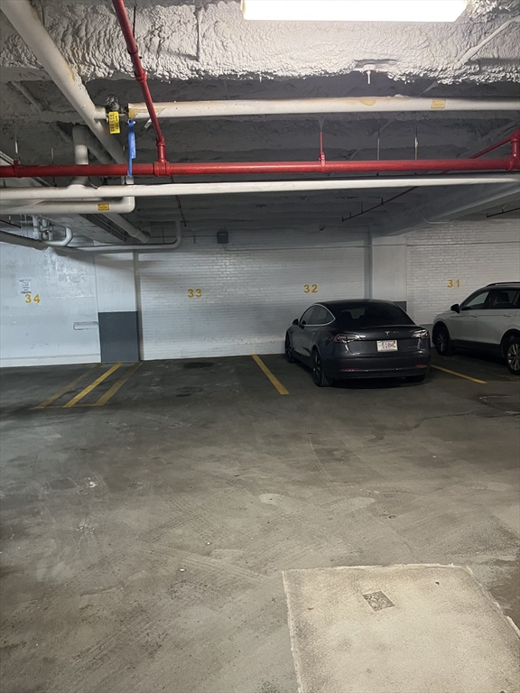 12 Stoneholm Street, Unit 322 Boston, MA 02115 - Photo 29 of 33 a car parked in a garage