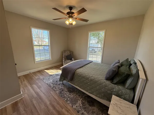 a bedroom with a bed and window