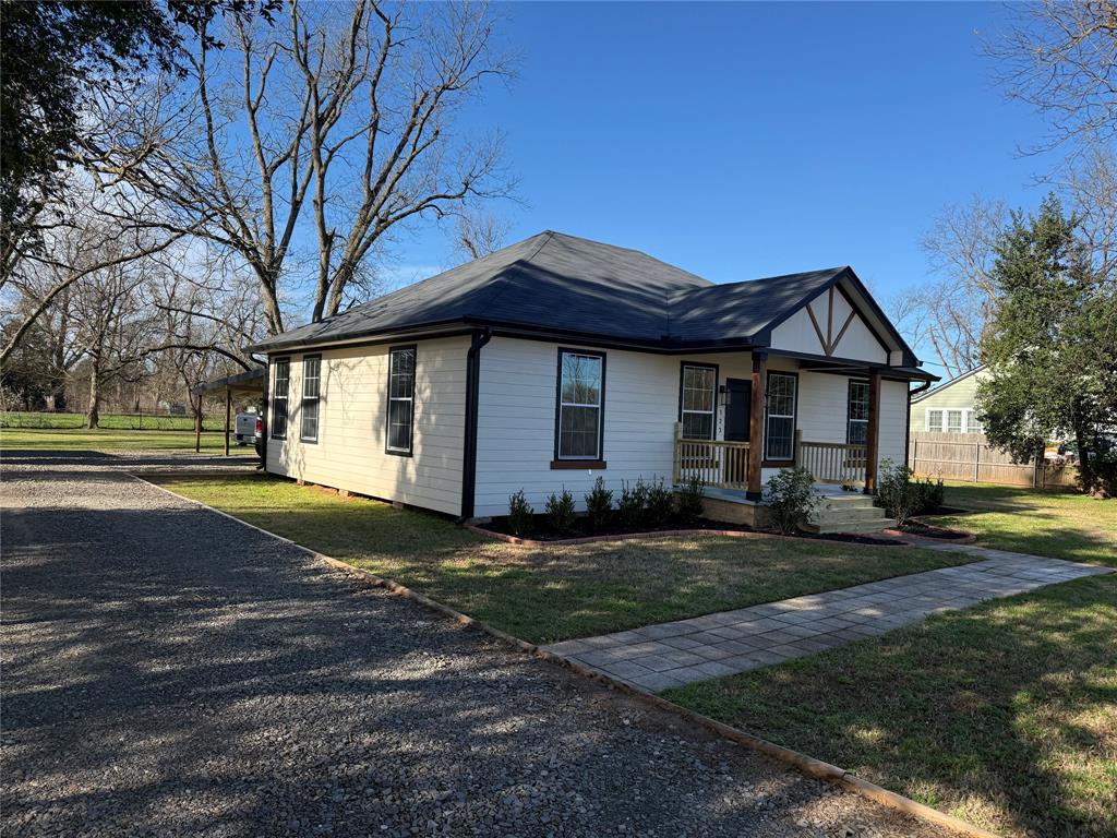 123 Church Street Belcher, LA 71004 - Photo 2 of 30 a front view of a house with a garden