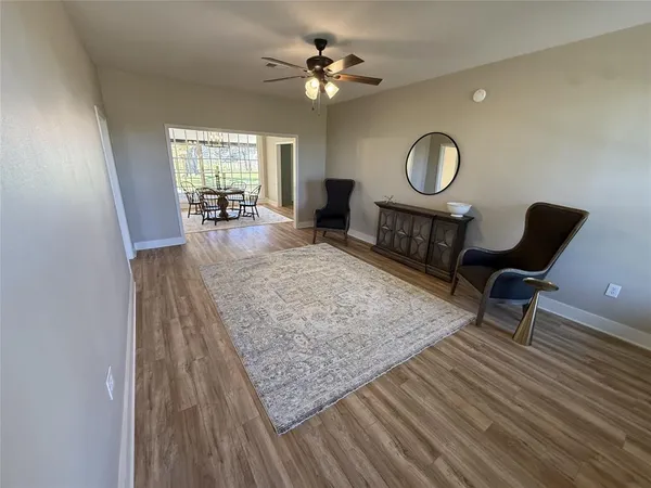 a living room with furniture and a rug