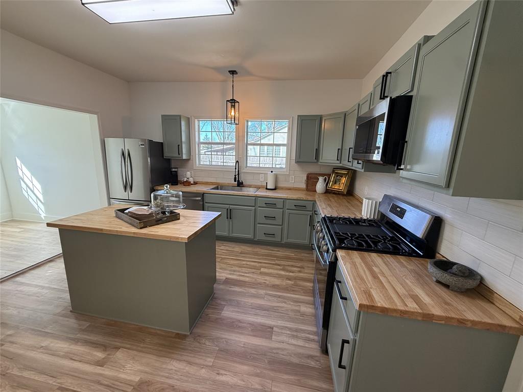 123 Church Street Belcher, LA 71004 - Photo 10 of 30 a kitchen with a stove a refrigerator and a refrigerator