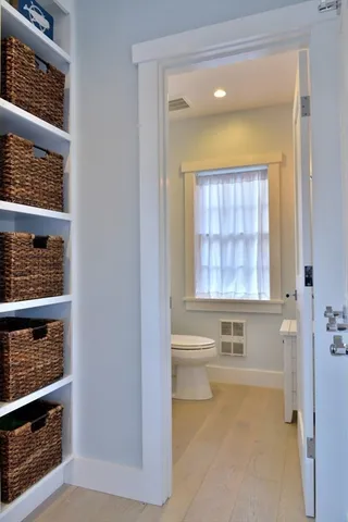 a spacious bathroom with a sink and a mirror