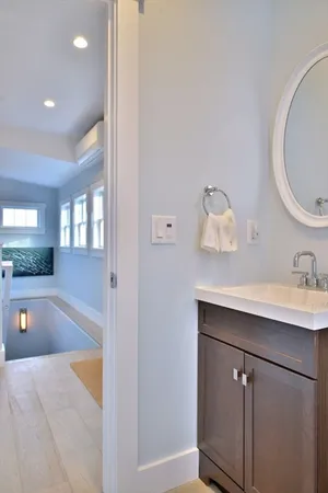 a bedroom with a bed and a lamp