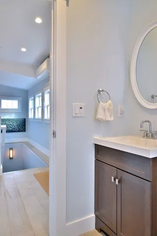 a bedroom with a bed and a lamp