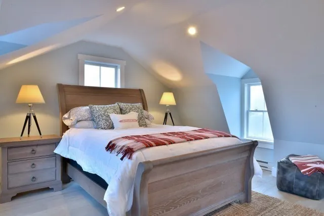 a bedroom with a bed and window