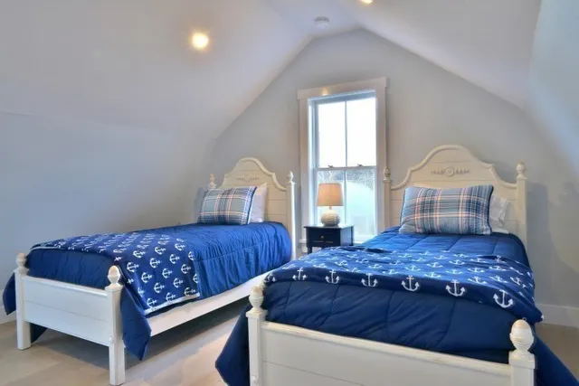 a bathroom with a sink a mirror and a toilet