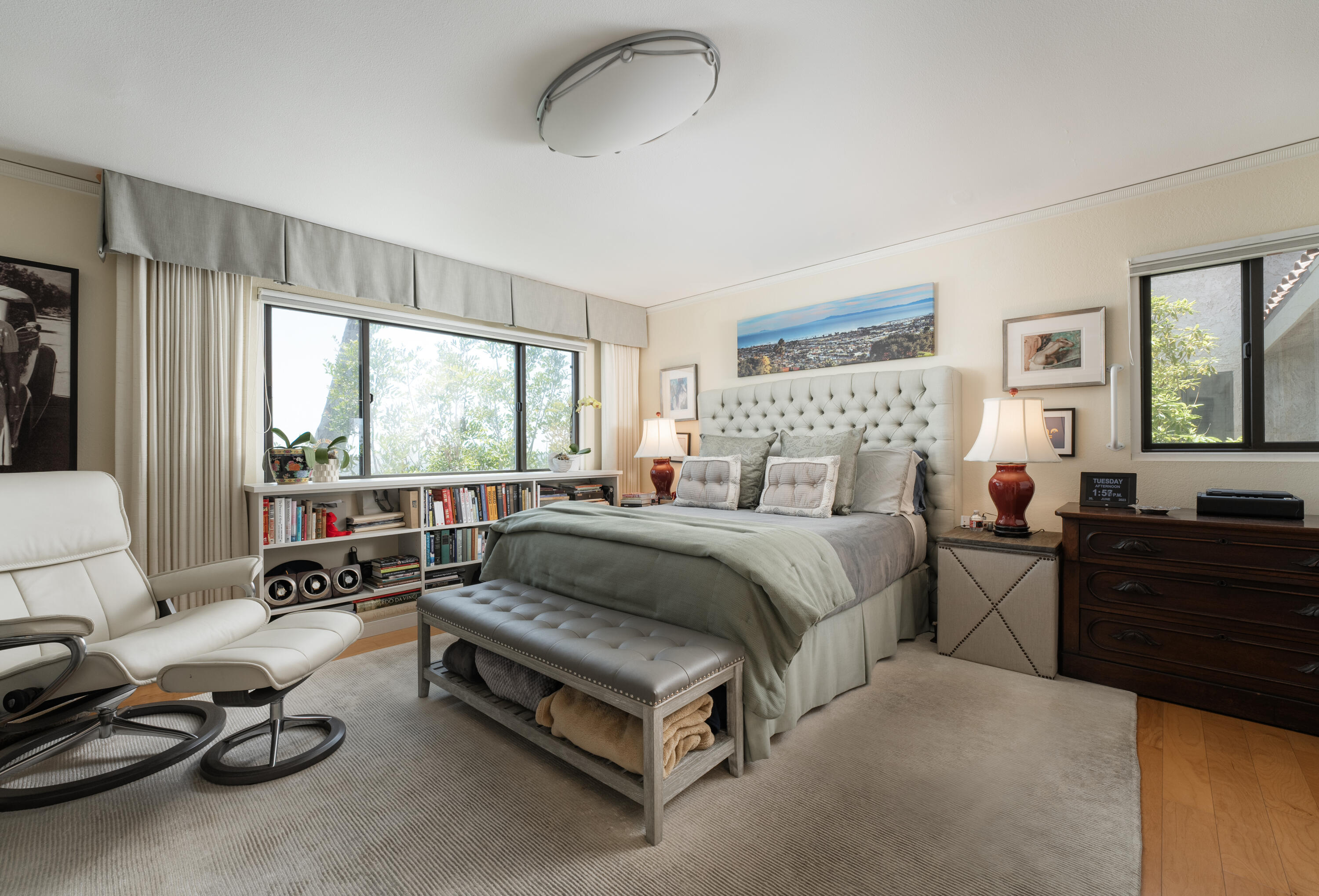 823 Via Granada Santa Barbara, CA 93103 - Photo 11 of 22 a spacious bedroom with a bed a couch and large window
