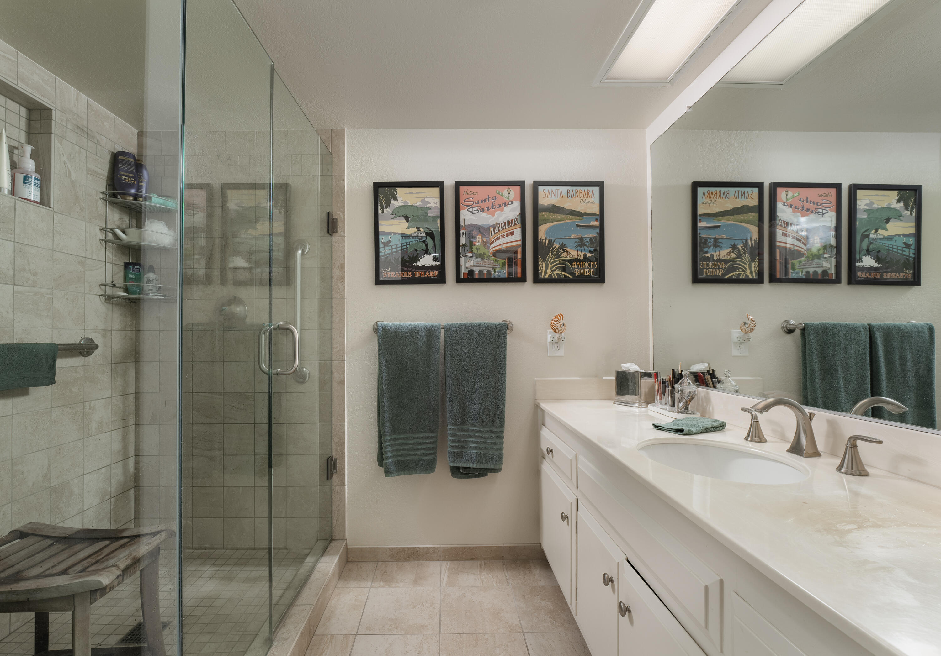 823 Via Granada Santa Barbara, CA 93103 - Photo 14 of 22 a bathroom with a double vanity sink mirror and shower