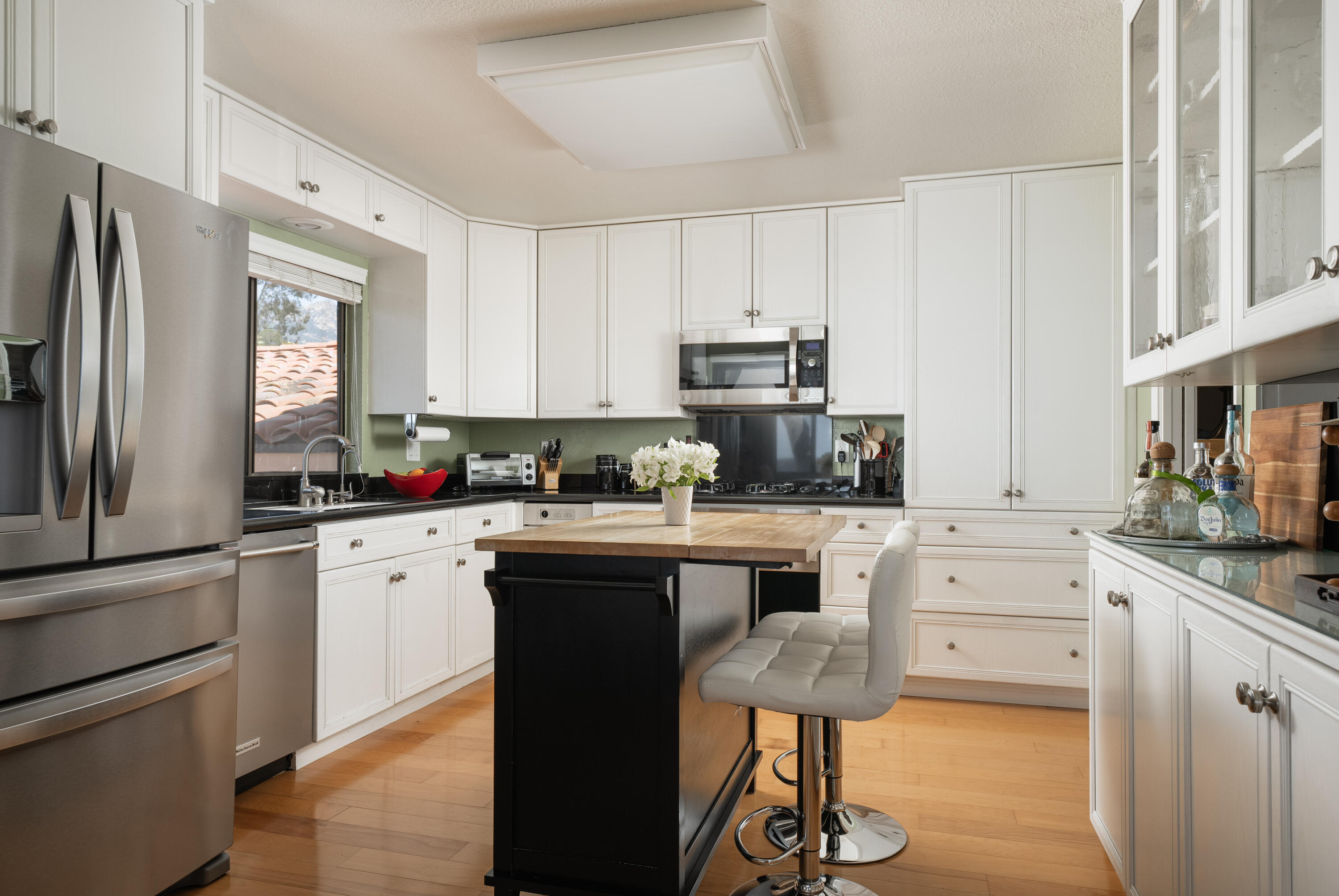 823 Via Granada Santa Barbara, CA 93103 - Photo 6 of 22 a kitchen with stainless steel appliances a stove a sink cabinets and a refrigerator