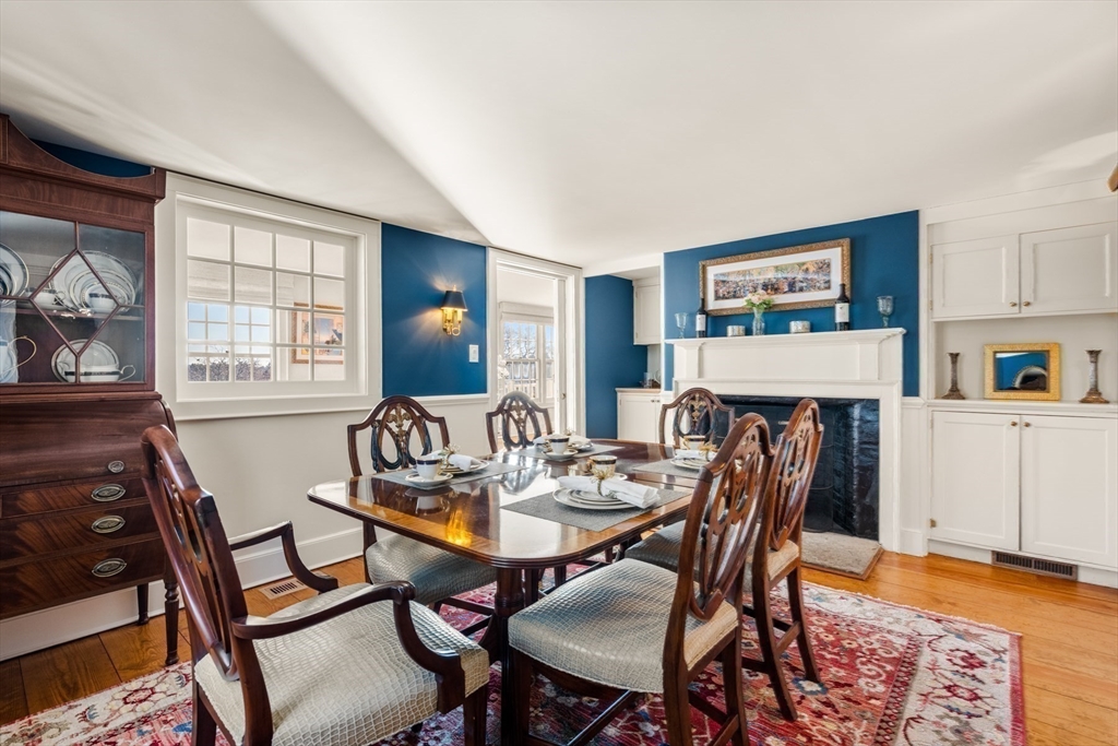 151 Oakland Street Wellesley, MA 02481 - Photo 14 of 42 a view of a dining room with furniture window and wooden floor