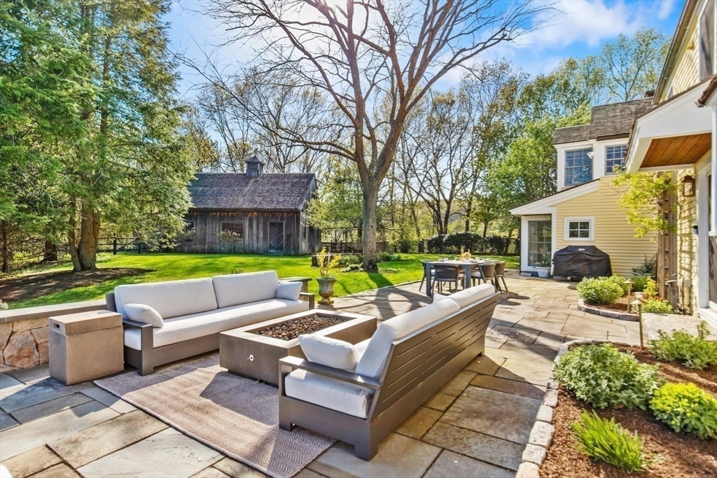 151 Oakland Street Wellesley, MA 02481 - Photo 33 of 42 a view of a patio with couches and a fire pit