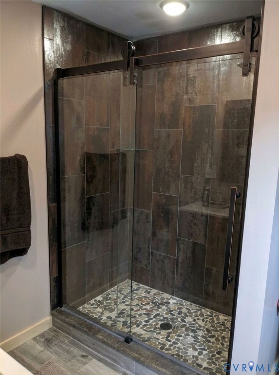 1081 Stones Road Walkerton, VA 23177 - Photo 8 of 23 Frameless glass shower enclosure with a barn door