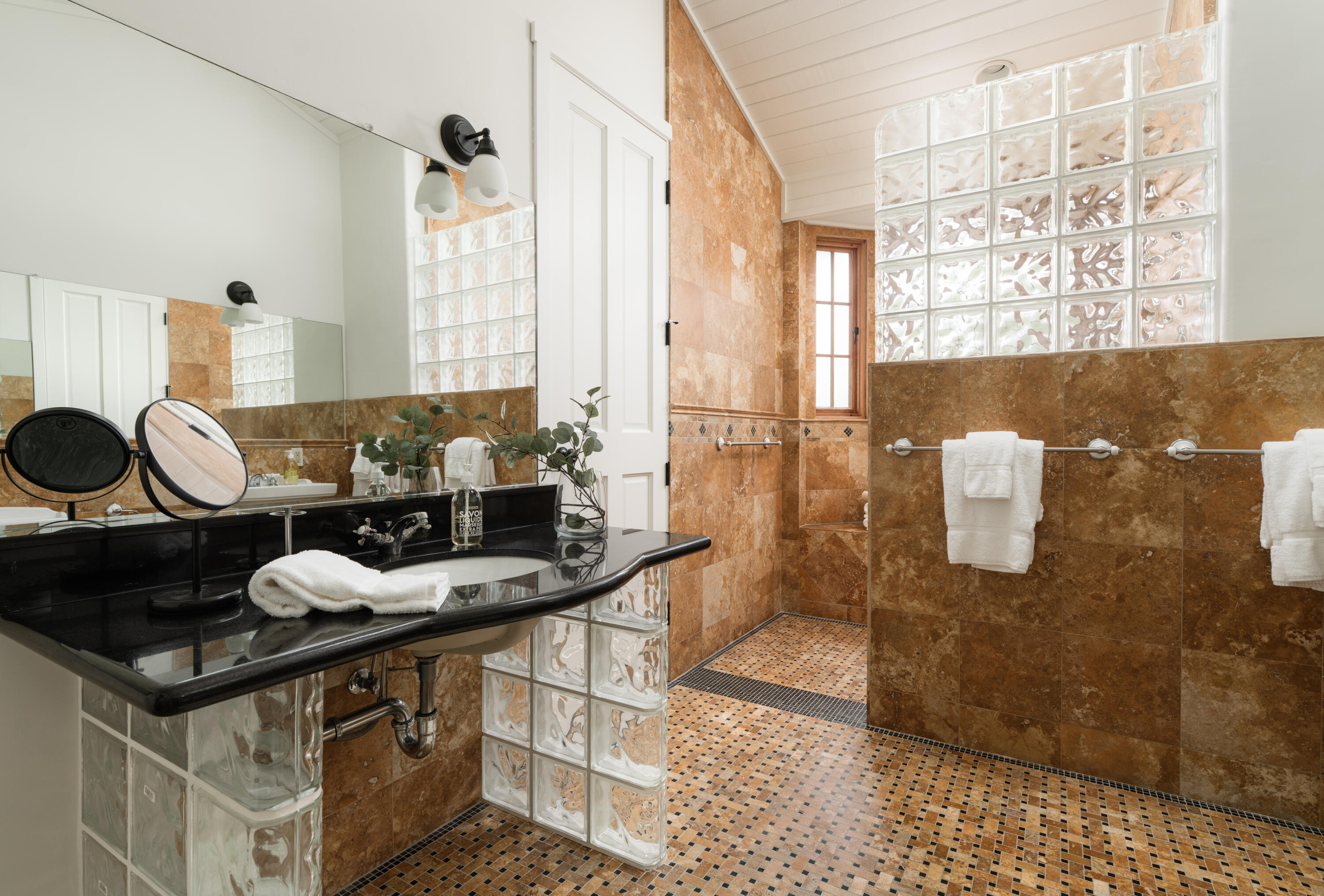 690 San Ysidro Road Montecito, CA 93108 - Photo 16 of 42 a kitchen with a stove a sink and a table
