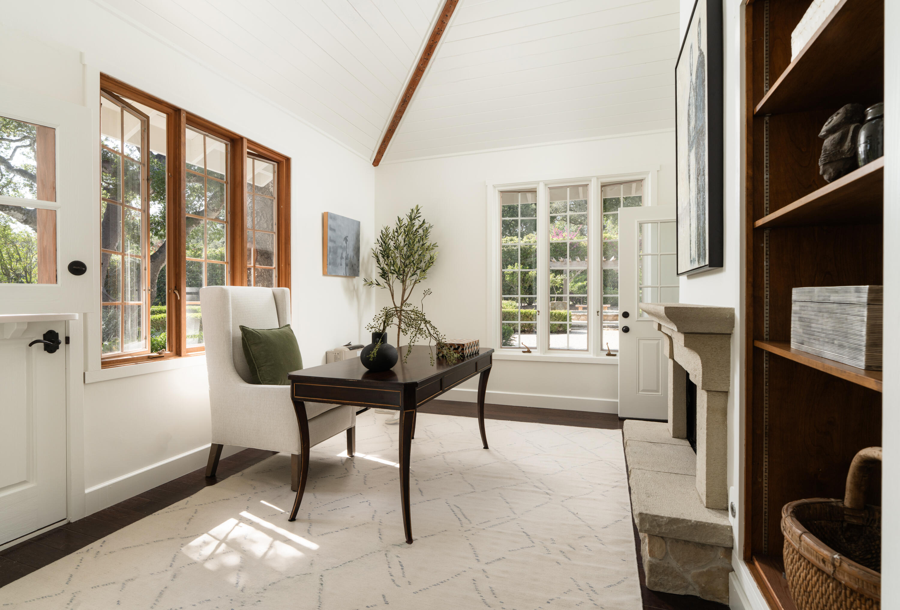 690 San Ysidro Road Montecito, CA 93108 - Photo 18 of 42 a living room with furniture a large window and a flat screen tv