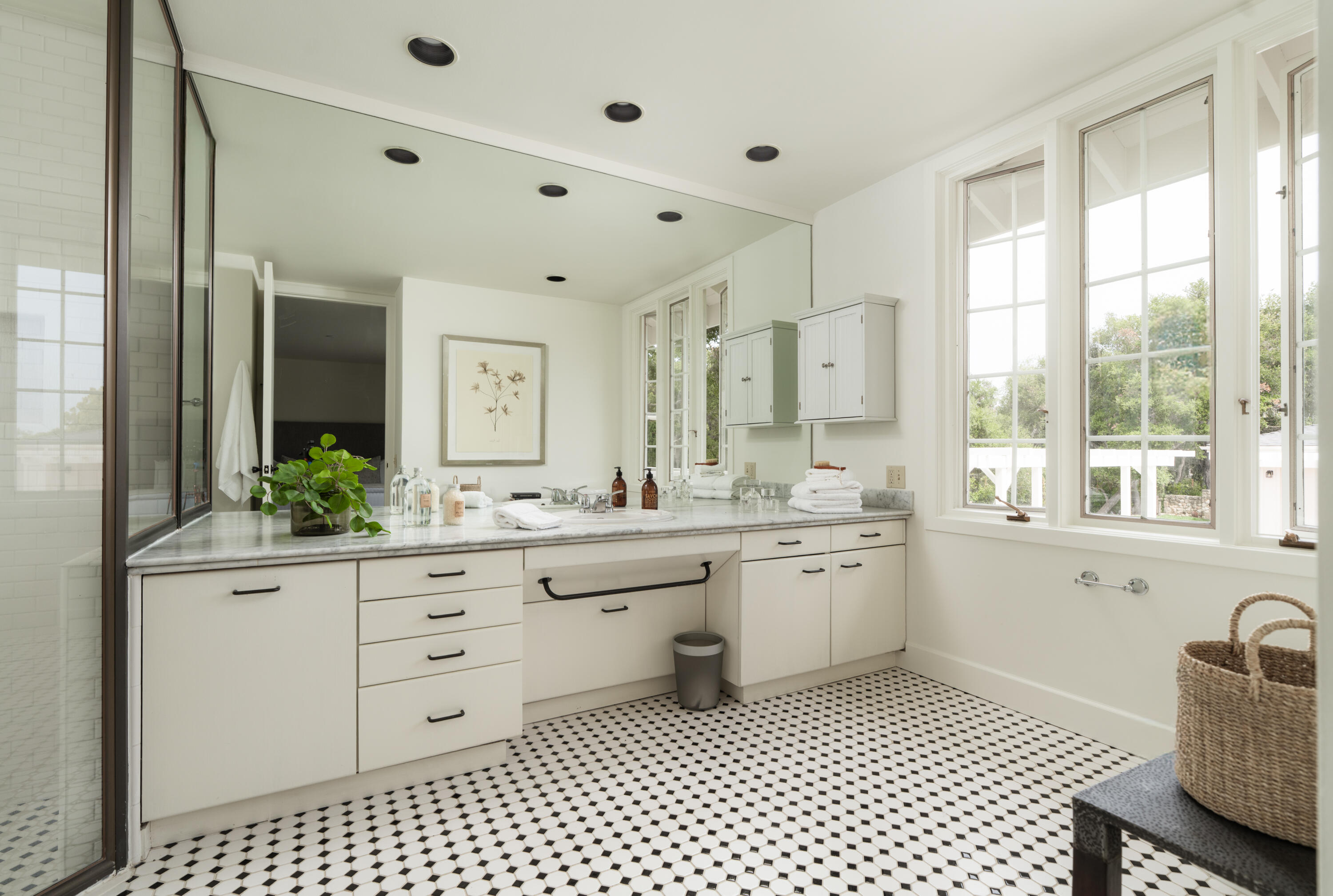 690 San Ysidro Road Montecito, CA 93108 - Photo 22 of 42 a spacious bathroom with a granite countertop sink a mirror and a bathtub