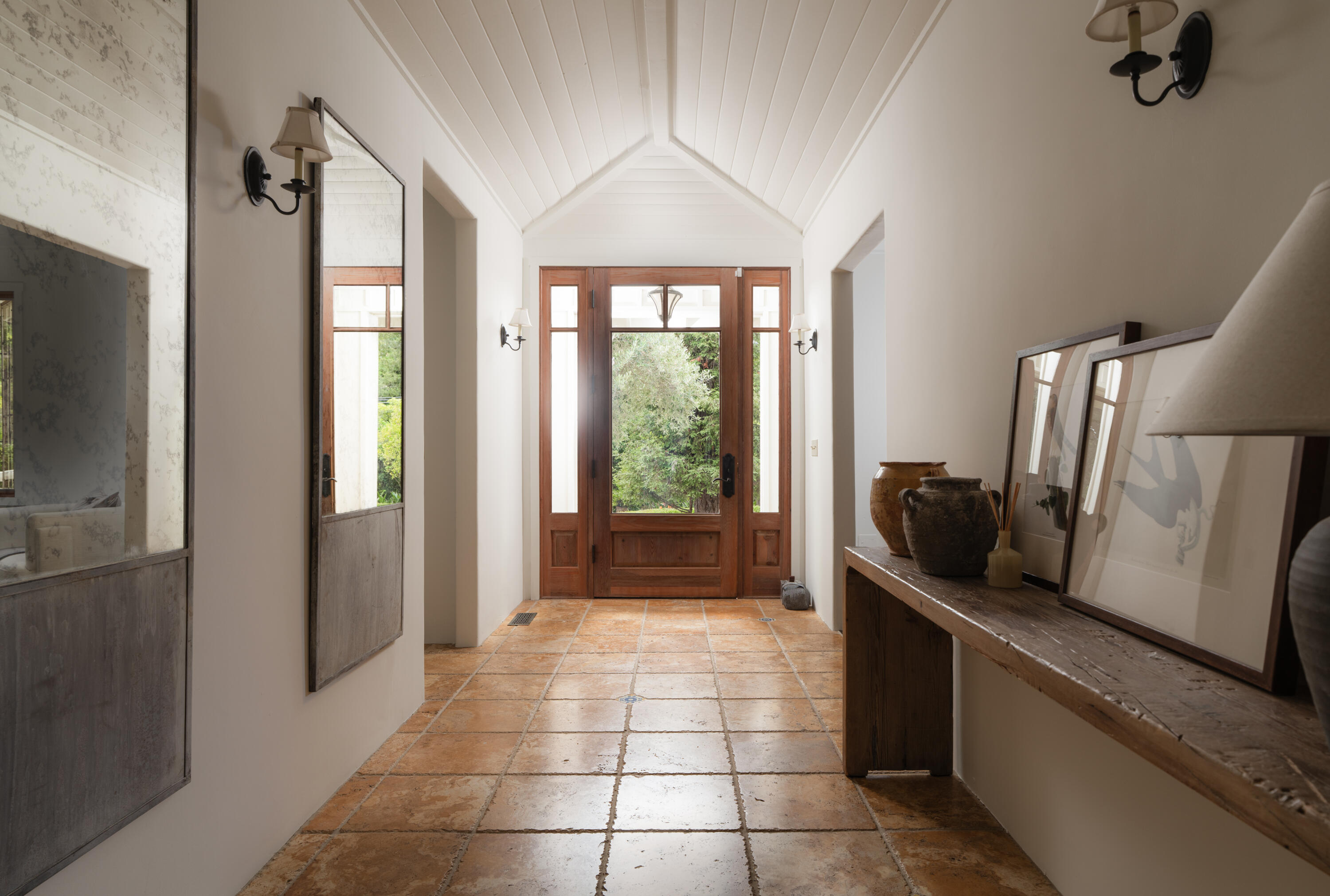 690 San Ysidro Road Montecito, CA 93108 - Photo 6 of 42 a kitchen with a window a refrigerator and wooden floor