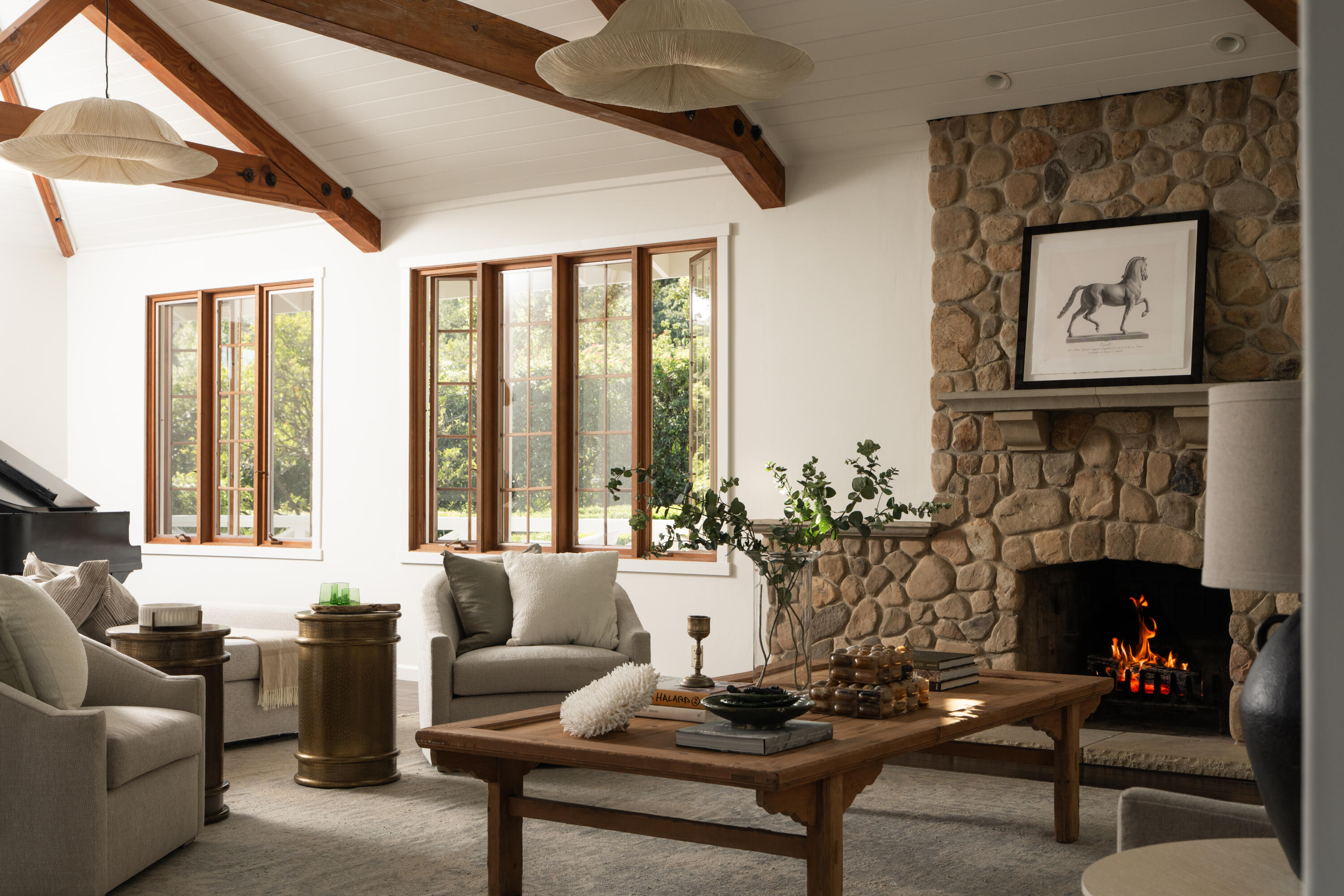 690 San Ysidro Road Montecito, CA 93108 - Photo 7 of 42 a living room with furniture potted plant and a fireplace