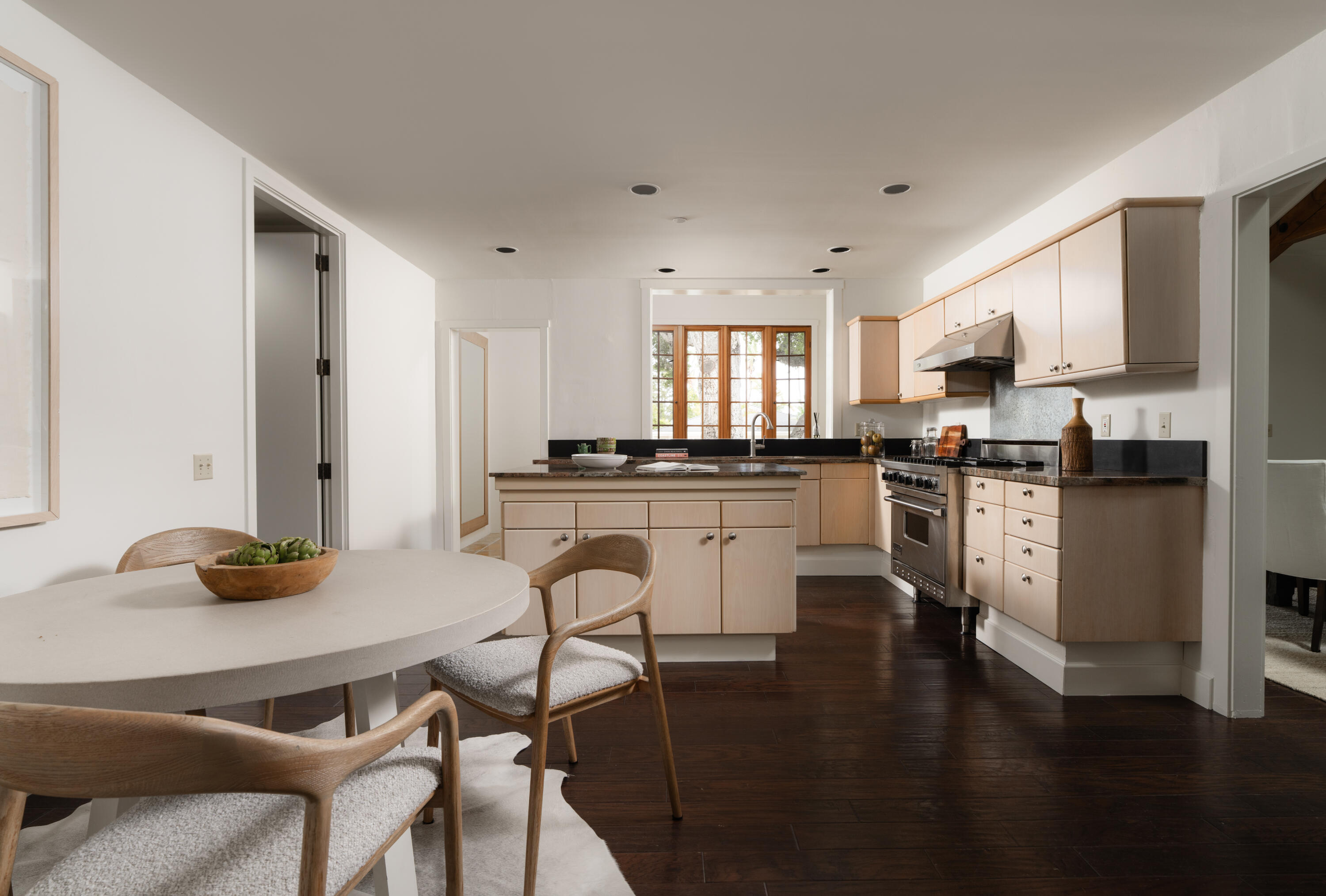 690 San Ysidro Road Montecito, CA 93108 - Photo 10 of 42 a kitchen with granite countertop a stove a sink a counter space and cabinets