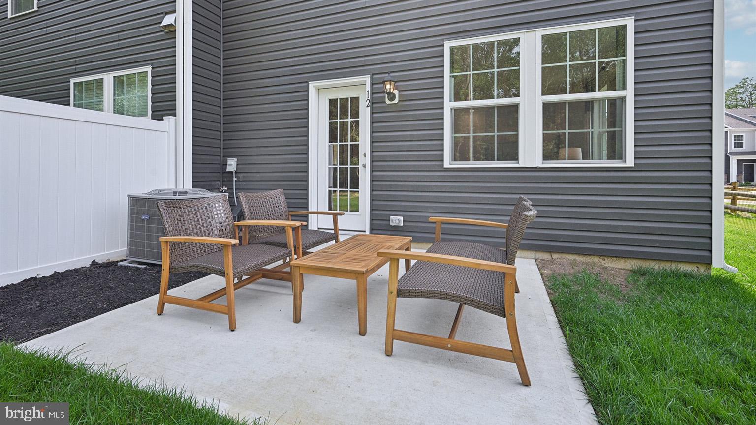 32 Reagan Drive Runnemede, NJ 08078 - Photo 36 of 48 a view of a backyard with a table and chair