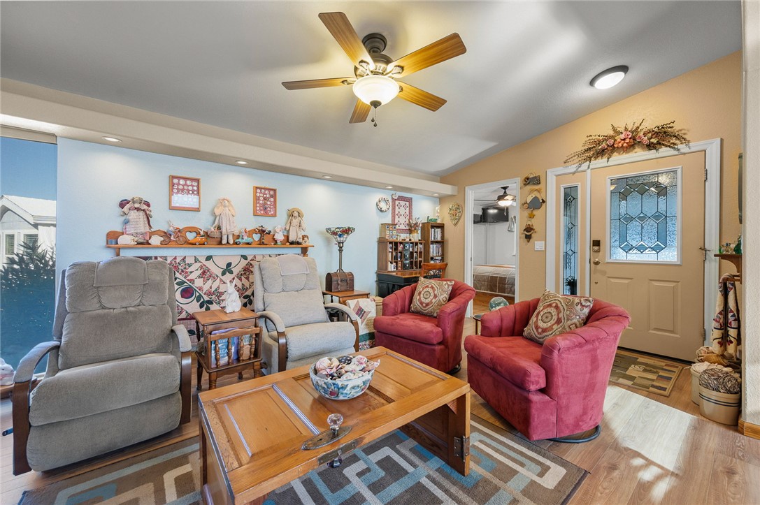 2000 Ramar Road, Unit 665 Bullhead City, AZ 86442 - Photo 12 of 83 Living room with luxury hard surface flooring, ceiling fan, recessed lighting, and defined seating area.