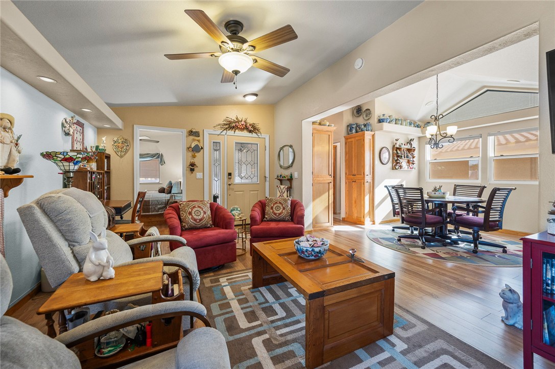 2000 Ramar Road, Unit 665 Bullhead City, AZ 86442 - Photo 15 of 83 Living and dining area combination featuring luxury hard surface flooring, ceiling fan, and functional open layout for entertaining.