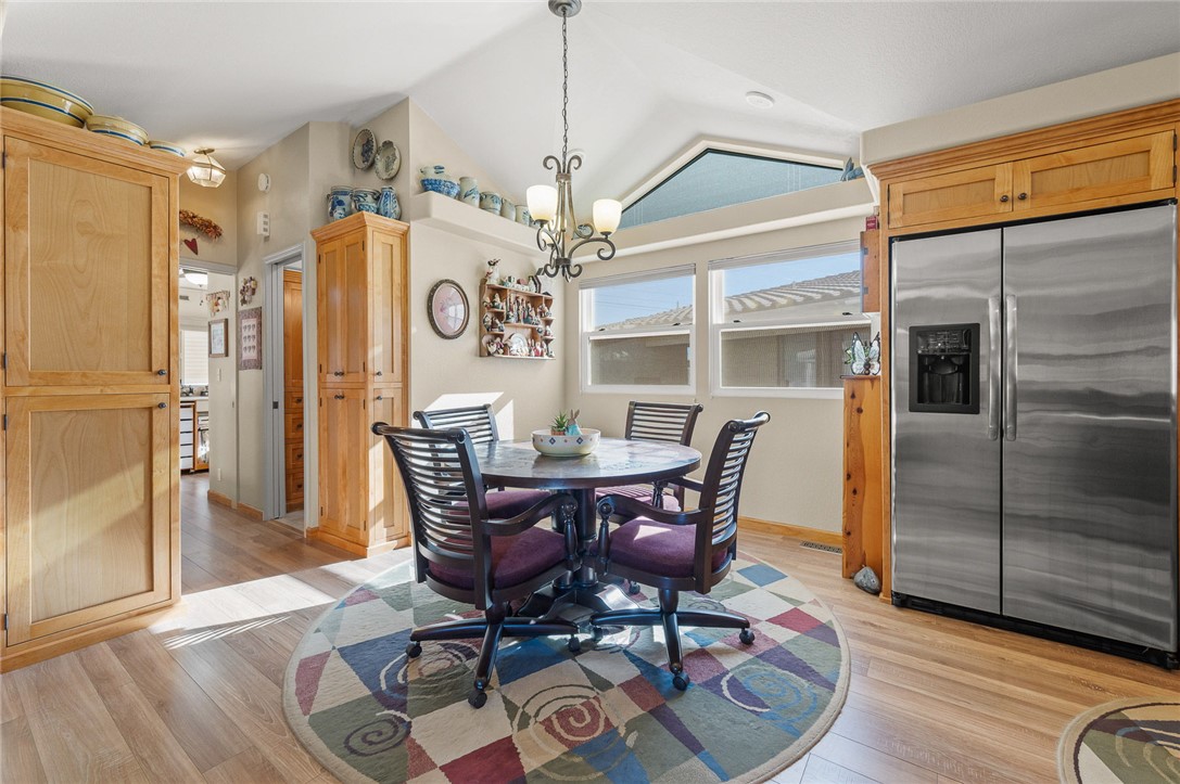 2000 Ramar Road, Unit 665 Bullhead City, AZ 86442 - Photo 20 of 83 Bright dining area with large windows, skylight, built-in cabinetry, and generous space for everyday dining or entertaining.