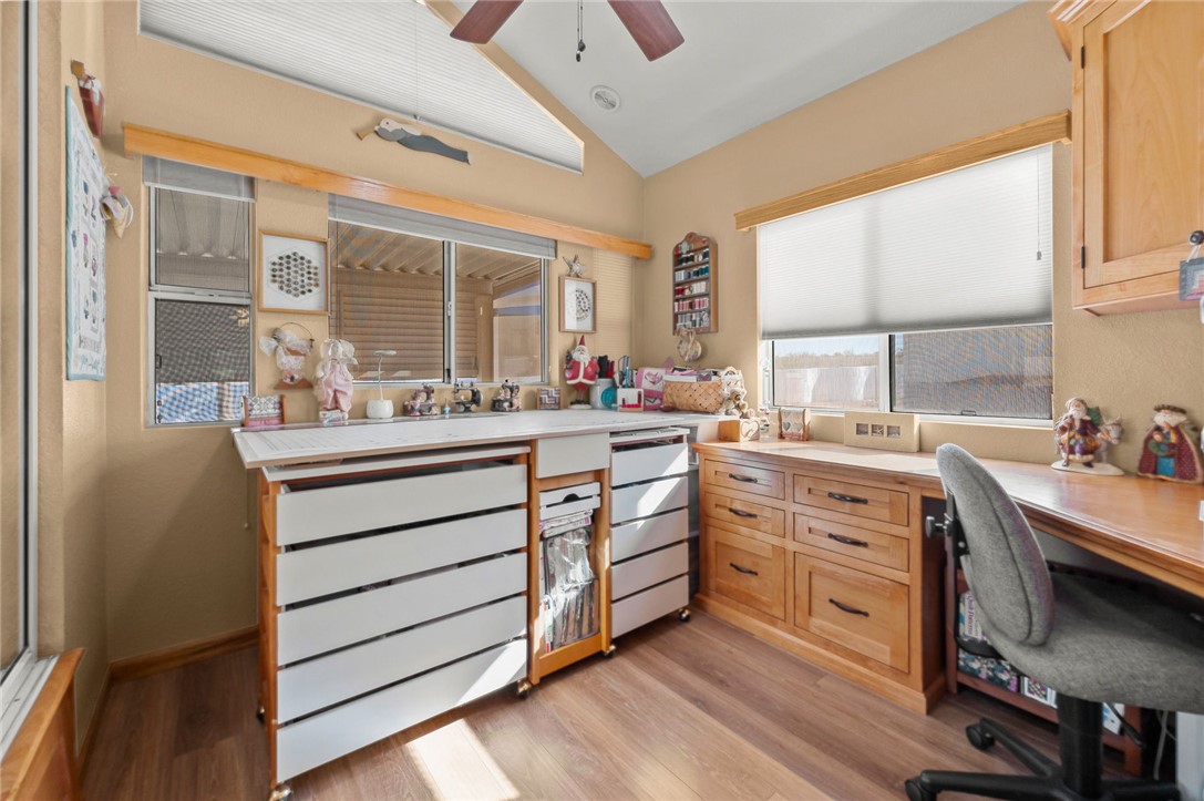 2000 Ramar Road, Unit 665 Bullhead City, AZ 86442 - Photo 24 of 83 Versatile flex space with custom cabinetry, drawer storage, and luxury hard surface flooring; non-built-in furniture can be removed to accommodate a bed and function as an additional bedroom if desired.