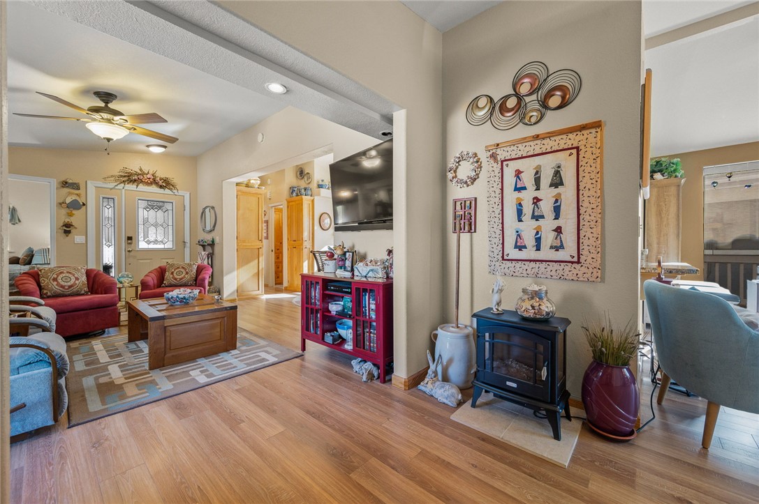 2000 Ramar Road, Unit 665 Bullhead City, AZ 86442 - Photo 36 of 83 Main living area featuring luxury hard surface flooring, recessed lighting, ceiling fan, and open connection to kitchen and dining spaces.
