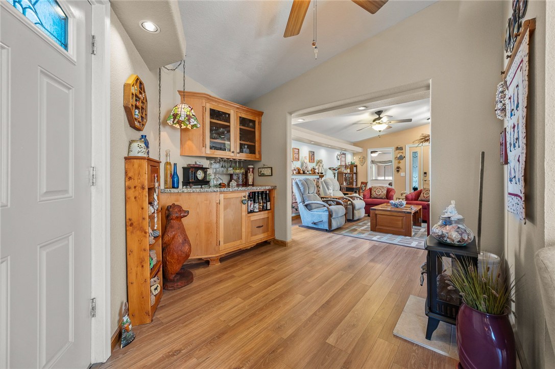 2000 Ramar Road, Unit 665 Bullhead City, AZ 86442 - Photo 37 of 83 Alternate view of living space highlighting luxury hard surface flooring, custom built-ins, and smooth flow between living areas.