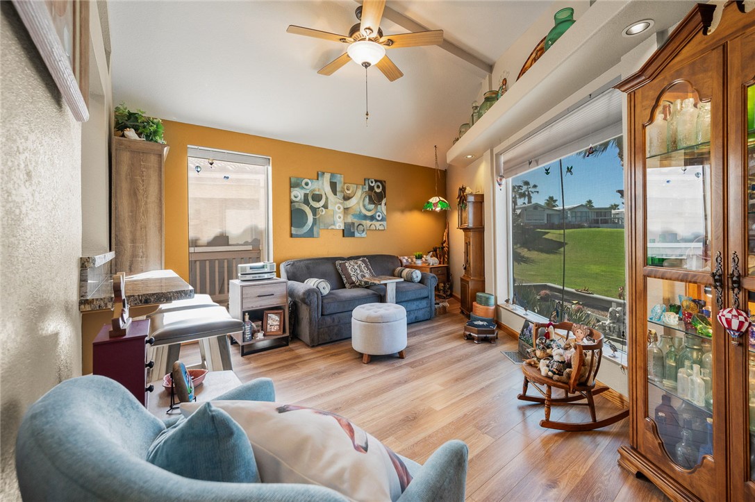 2000 Ramar Road, Unit 665 Bullhead City, AZ 86442 - Photo 38 of 83 Secondary living or sitting area with large windows, luxury hard surface flooring, ceiling fan, and abundant natural light.
