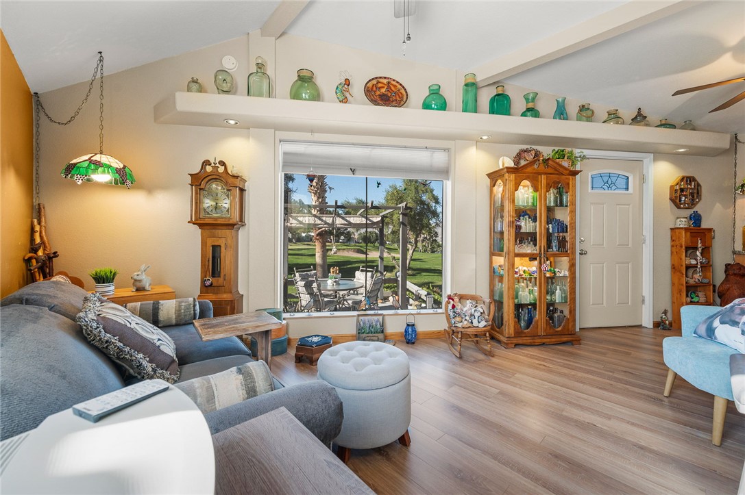 2000 Ramar Road, Unit 665 Bullhead City, AZ 86442 - Photo 41 of 83 Living area with large picture window, golf course views, and luxury hard surface flooring.
