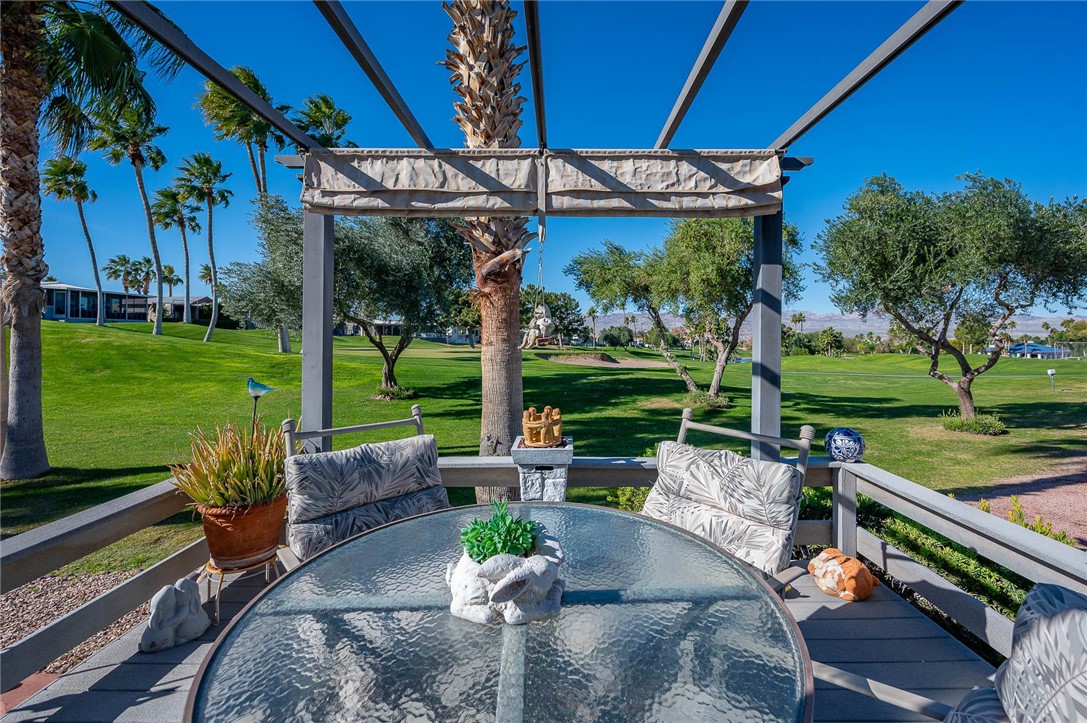 2000 Ramar Road, Unit 665 Bullhead City, AZ 86442 - Photo 48 of 83 Golf course?facing deck with ample room for outdoor dining, low-maintenance decking, and lush greenbelt views.
