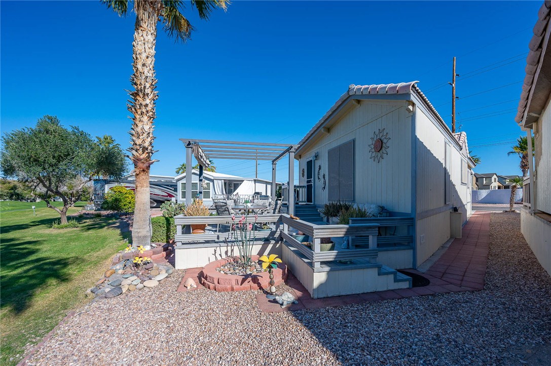 2000 Ramar Road, Unit 665 Bullhead City, AZ 86442 - Photo 49 of 83 Rear exterior with elevated deck and direct golf course frontage.
