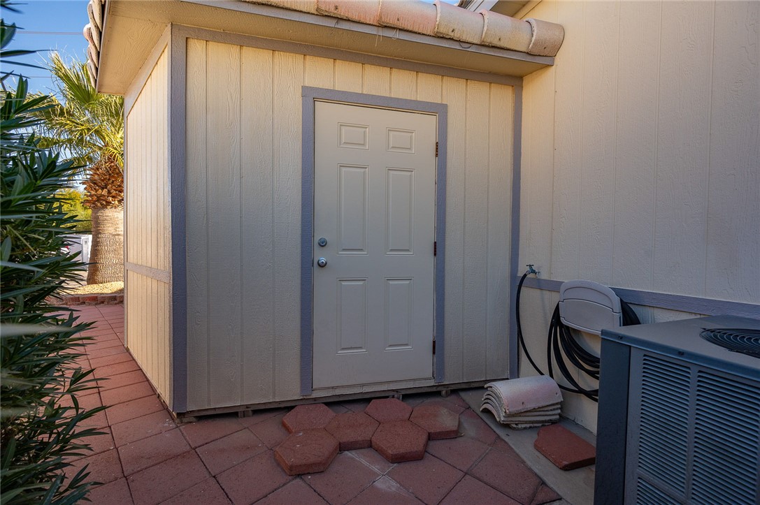 2000 Ramar Road, Unit 665 Bullhead City, AZ 86442 - Photo 54 of 83 Another exterior storage shed emphasizing ample storage capacity, easy access, and excellent utility rarely found in this community