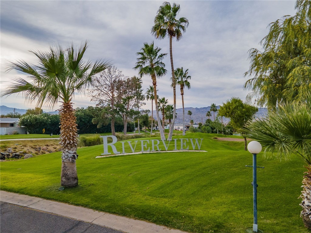 2000 Ramar Road, Unit 665 Bullhead City, AZ 86442 - Photo 61 of 83 Landscaped community signage set along the golf course, highlighting the Riverview RV Resort location.
