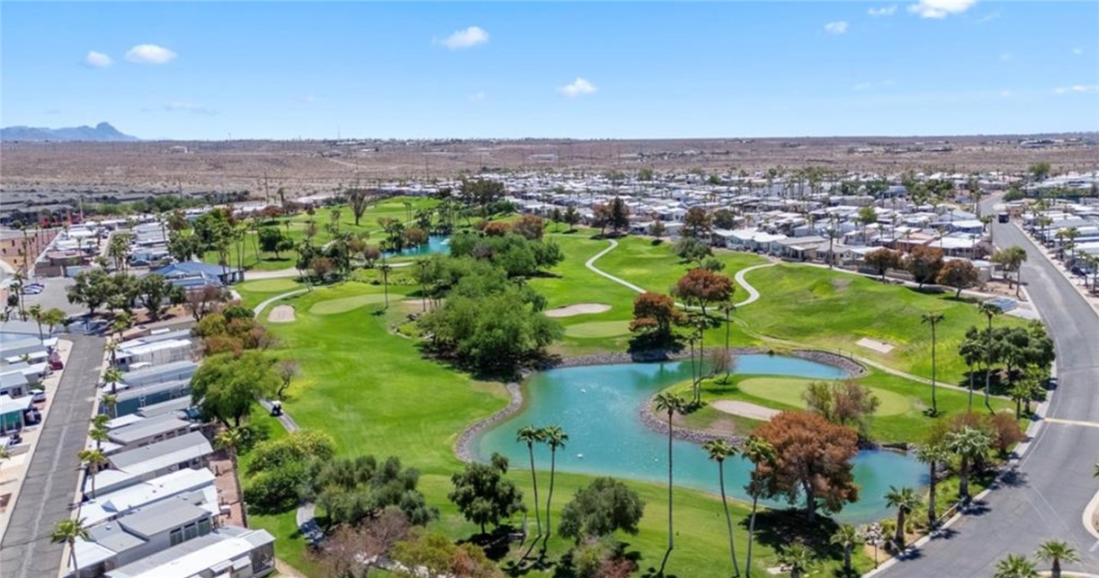 2000 Ramar Road, Unit 665 Bullhead City, AZ 86442 - Photo 62 of 83 Aerial view of the championship golf course, featuring manicured fairways, greens, and water features.