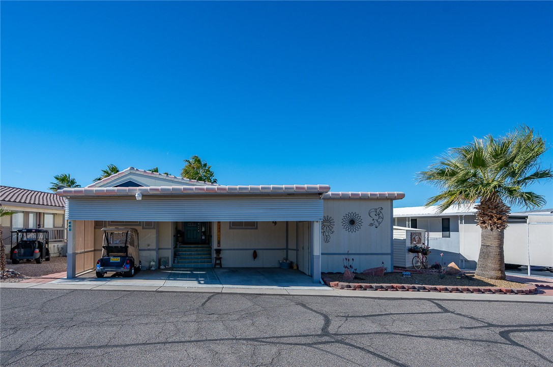 Inviting curb appeal with covered parking and easy, low-maintenance living.