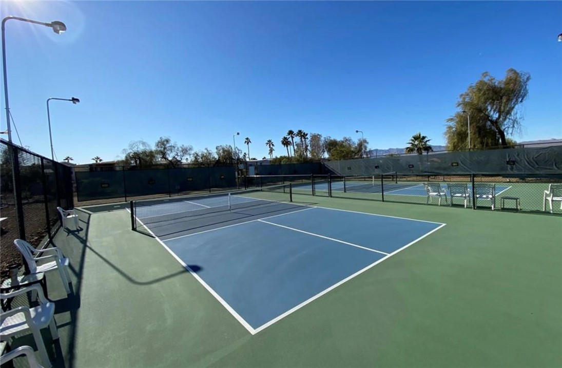 2000 Ramar Road, Unit 665 Bullhead City, AZ 86442 - Photo 70 of 83 Ground-level view of well-maintained pickleball and tennis courts, designed for active, social play.