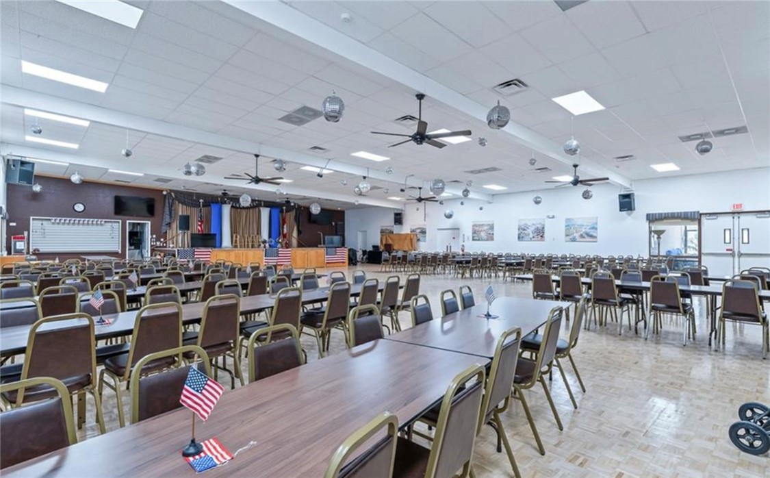 2000 Ramar Road, Unit 665 Bullhead City, AZ 86442 - Photo 74 of 83 Community event hall with large gathering space, stage area, and seating for social functions and activities.