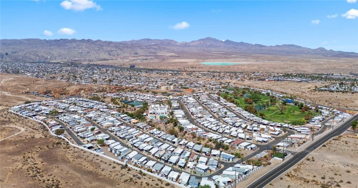 2000 Ramar Road, Unit 665 Bullhead City, AZ 86442 - Photo 81 of 83 Wide aerial view showcasing the full Riverview RV Resort layout, including golf course, amenities, and surrounding desert and mountain landscape.