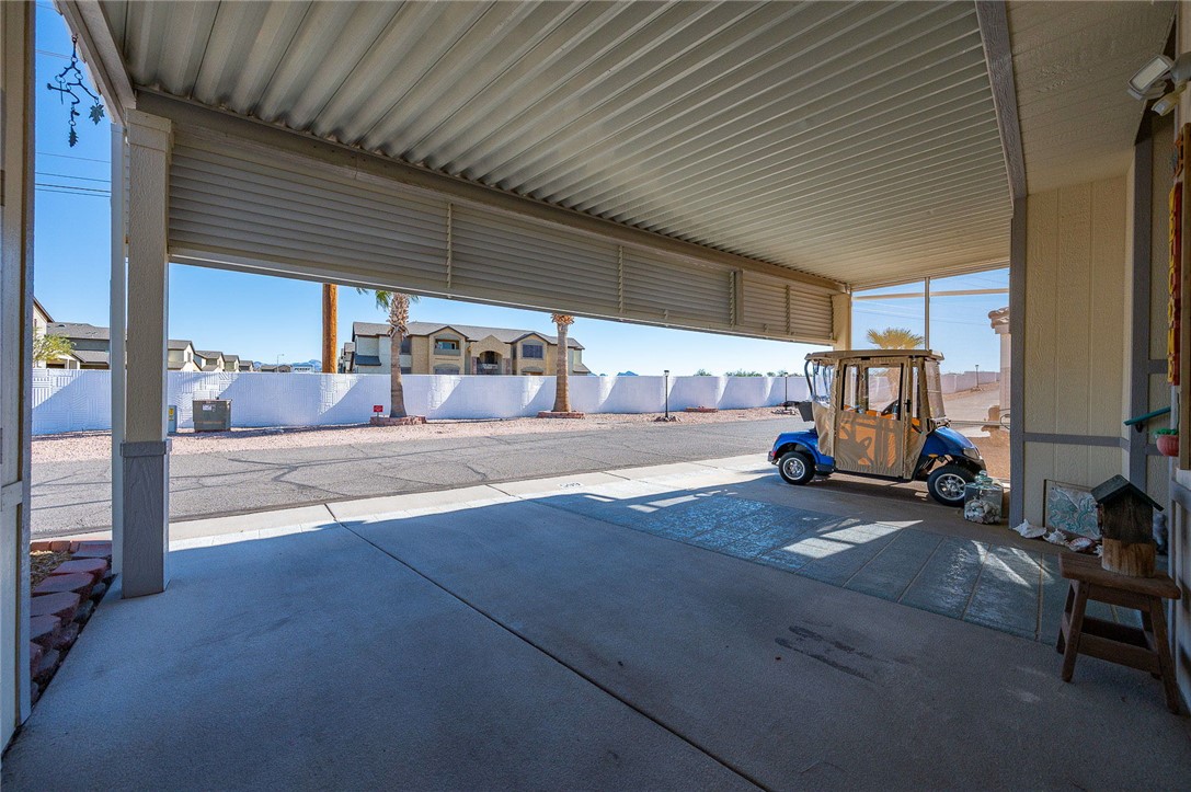 2000 Ramar Road, Unit 665 Bullhead City, AZ 86442 - Photo 9 of 83 Expansive covered parking with plenty of room for vehicles, golf cart, and everyday ease.