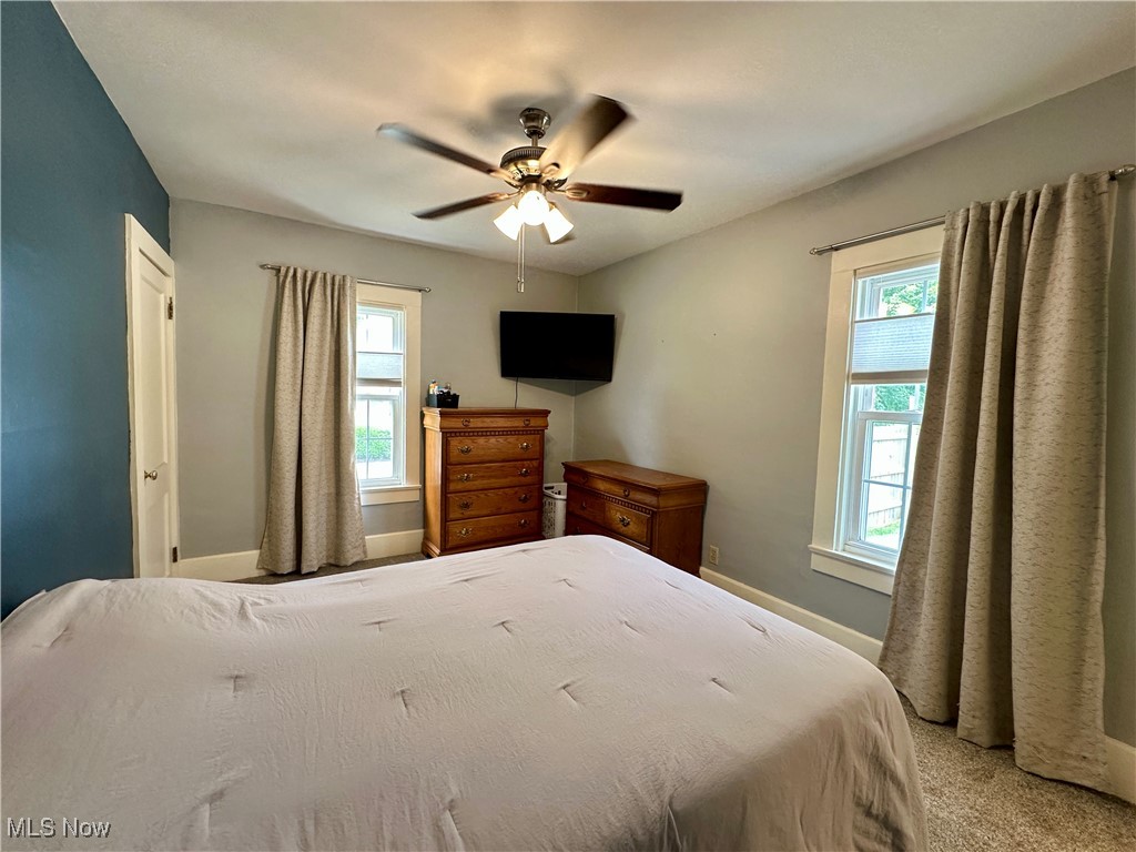 9574 Quarry Road Amherst, OH 44001 - Photo 22 of 31 Bedroom featuring ceiling fan and carpet