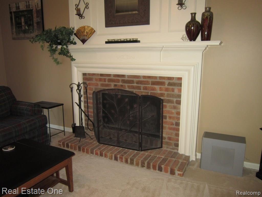45347 Courtview Trail Novi, MI 48375 - Photo 12 of 31 fireplace.JPG