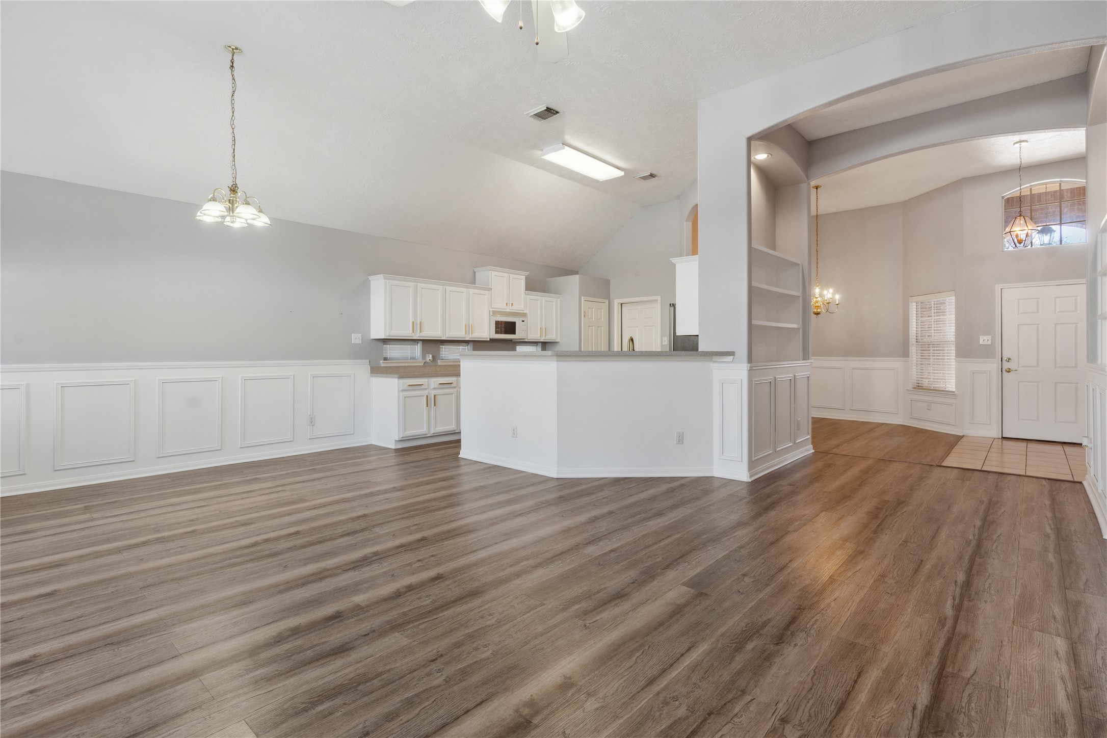7906 Fortrose Court Houston, TX 77070 - Photo 11 of 28 a view of a kitchen with a sink and wooden floor