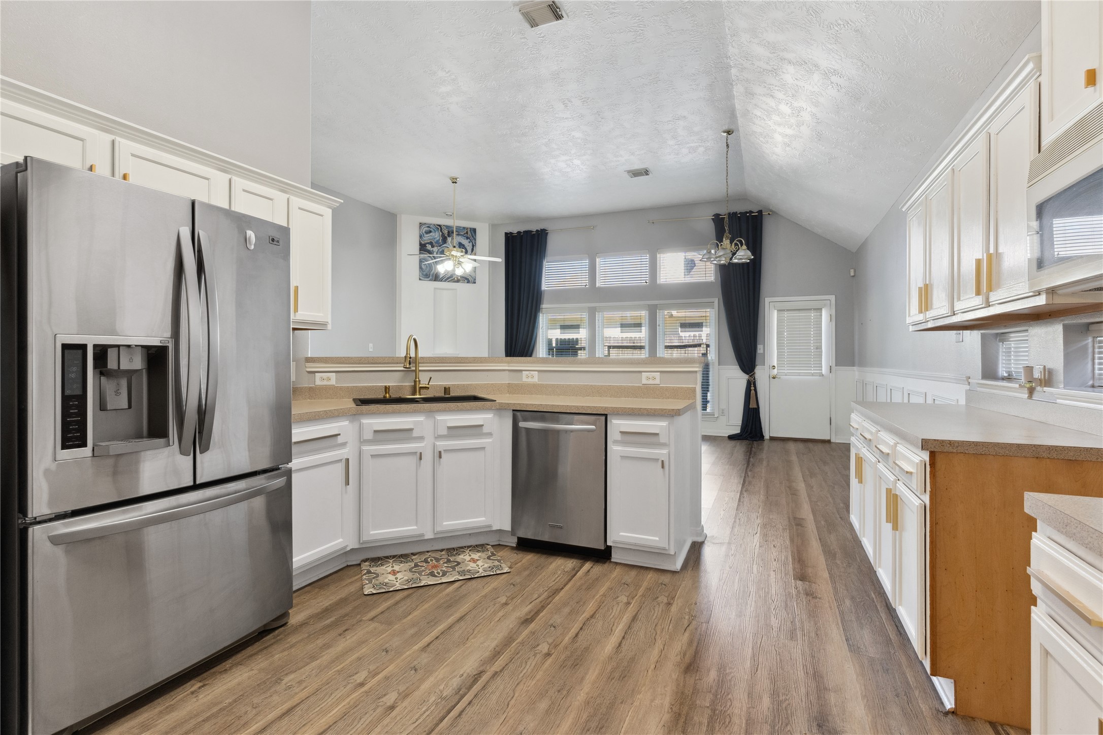 7906 Fortrose Court Houston, TX 77070 - Photo 13 of 28 a kitchen with stainless steel appliances a refrigerator sink and cabinets