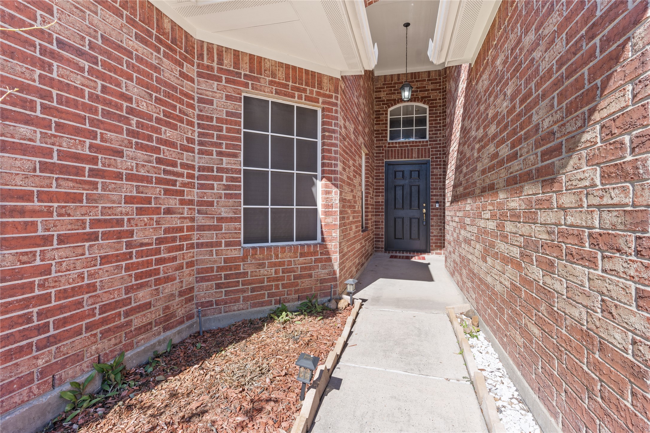 7906 Fortrose Court Houston, TX 77070 - Photo 4 of 28 a view of a brick house with many windows