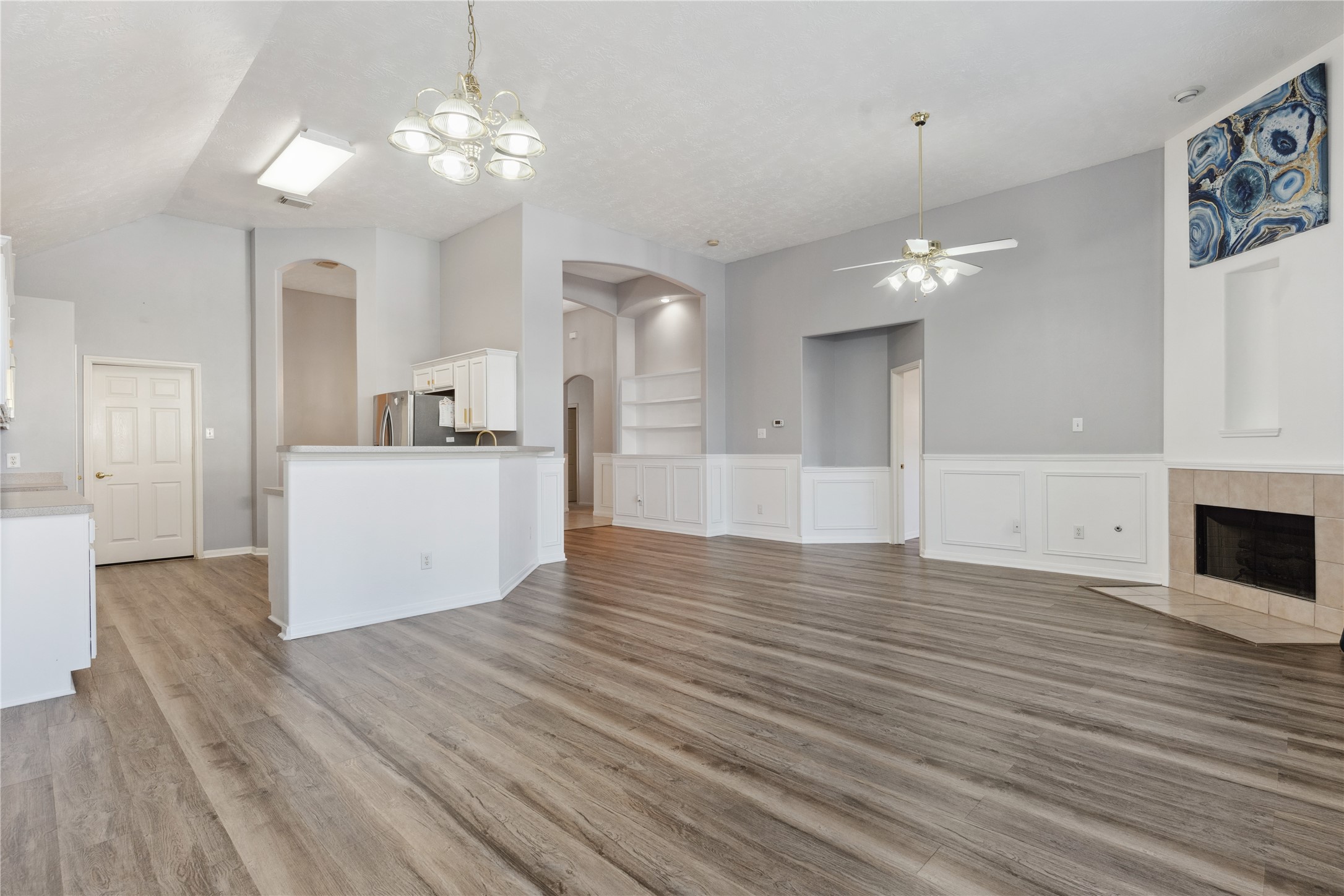 7906 Fortrose Court Houston, TX 77070 - Photo 10 of 28 a view of a kitchen with furniture and wooden floor