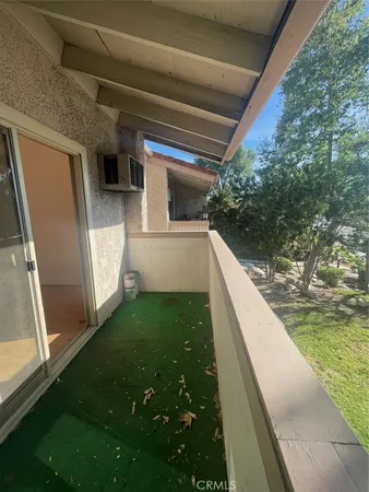 a view of balcony with swimming pool fire pit and outdoor seating