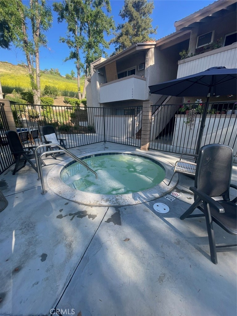 5800 Kanan Road, Unit 247 Agoura Hills, CA 91301 - Photo 13 of 16 a view of balcony with swimming pool fire pit and outdoor seating